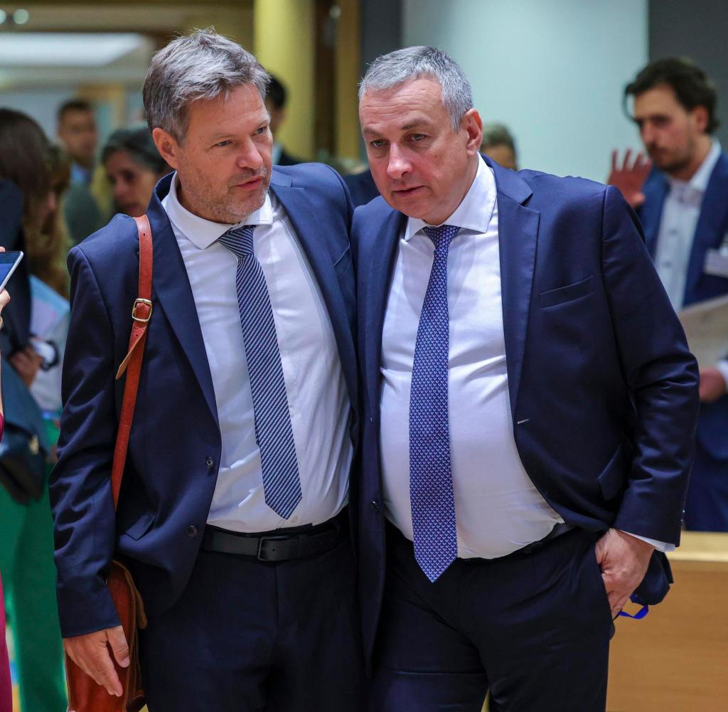 Czech Republic's Industry and Trade Minister Jozef Sikela, right, speaks with Germany's Energy Minister Robert Habeck during a meeting of EU energy ministers at the European Council building in Brussels, Friday, Sept. 9, 2022. European Union energy ministers are holding emergency talks to discuss a price cap on Russian natural gas and a possible windfall levy on European oil and gas companies making extraordinary profits as the war in Ukraine drives up energy prices.  (AP Photo/Olivier Matthys)