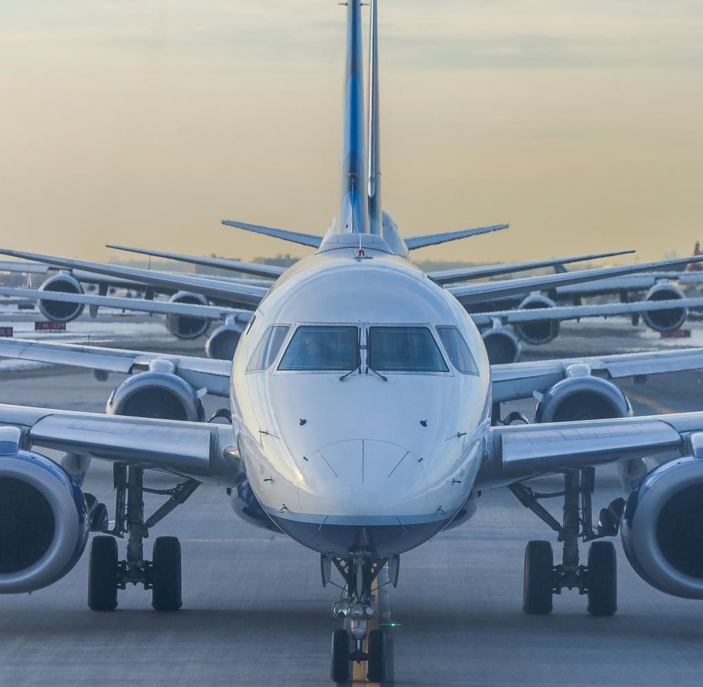 Compressed line of planes on runway