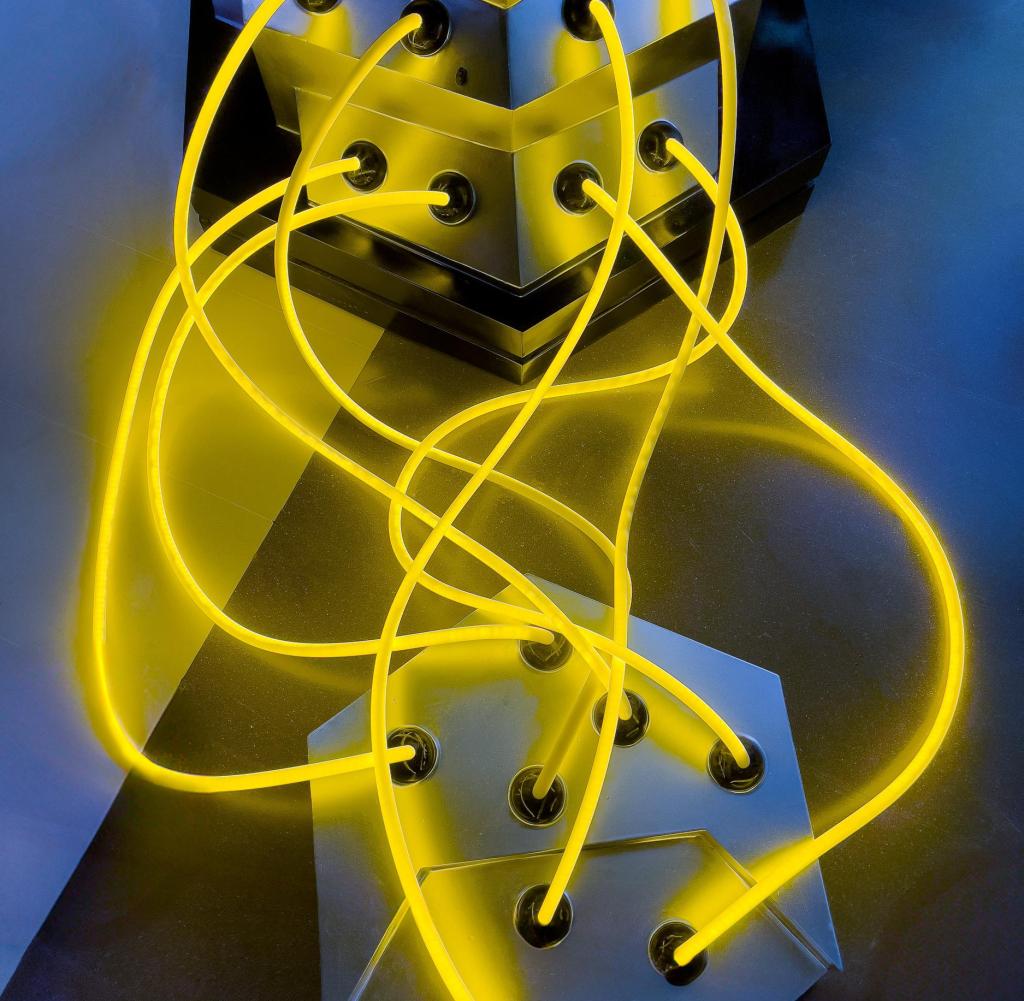 An image of a bunch of neon lights coming out of a box.